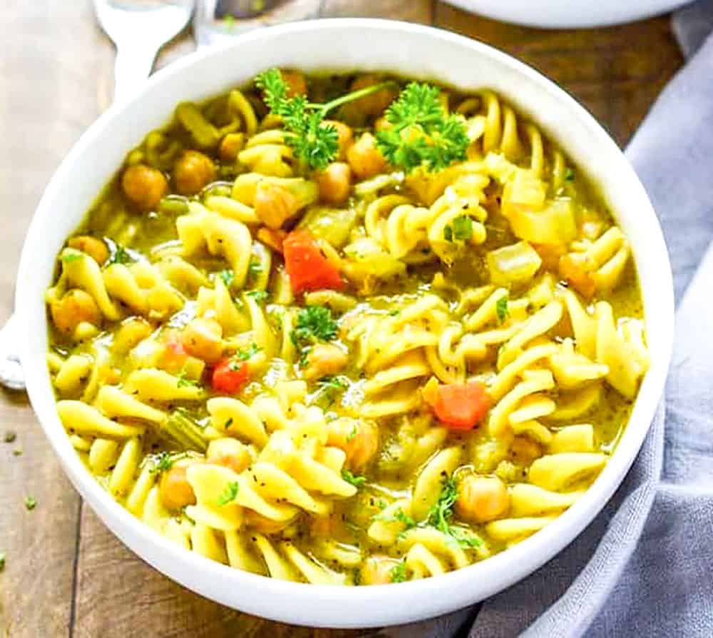 Vegan Chicken Noodle Soup In A White Bowl