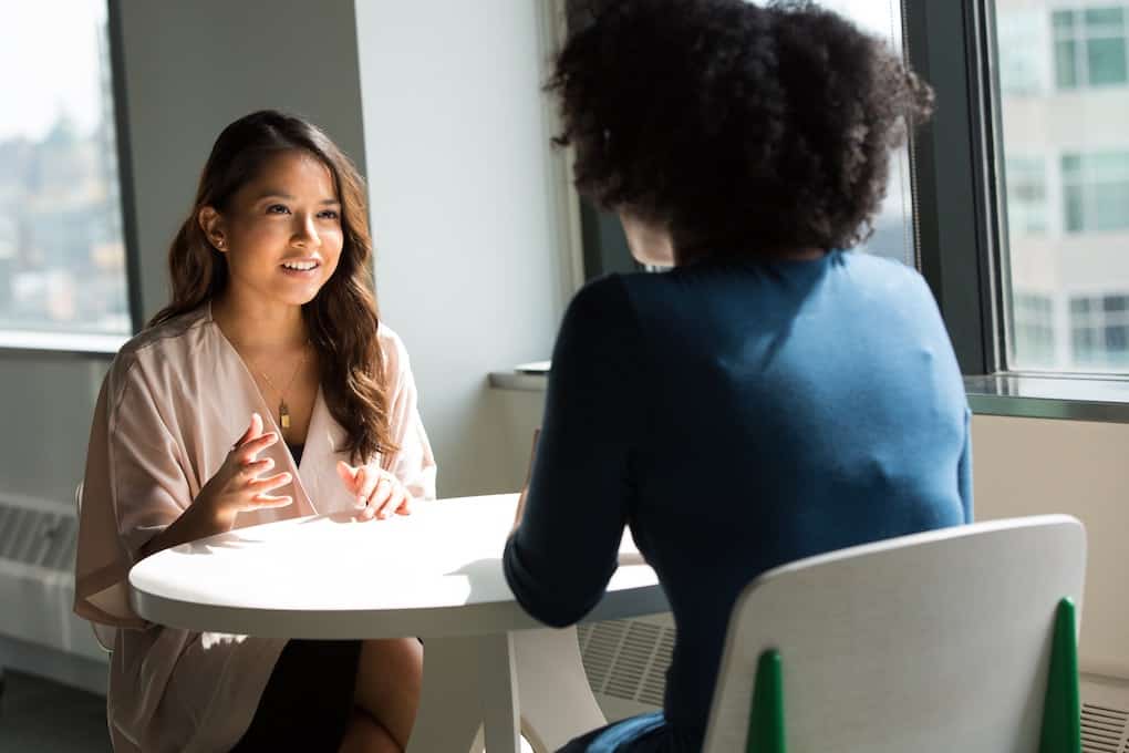 two women having a work interview across a table