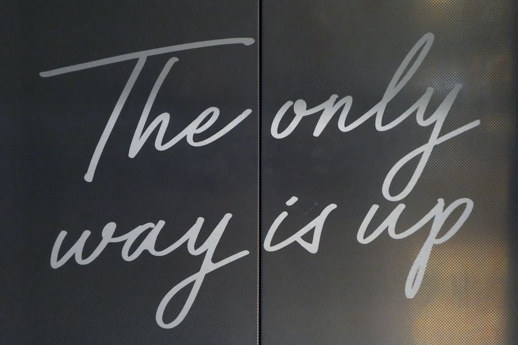 elevator sign which reads "the only way is up"