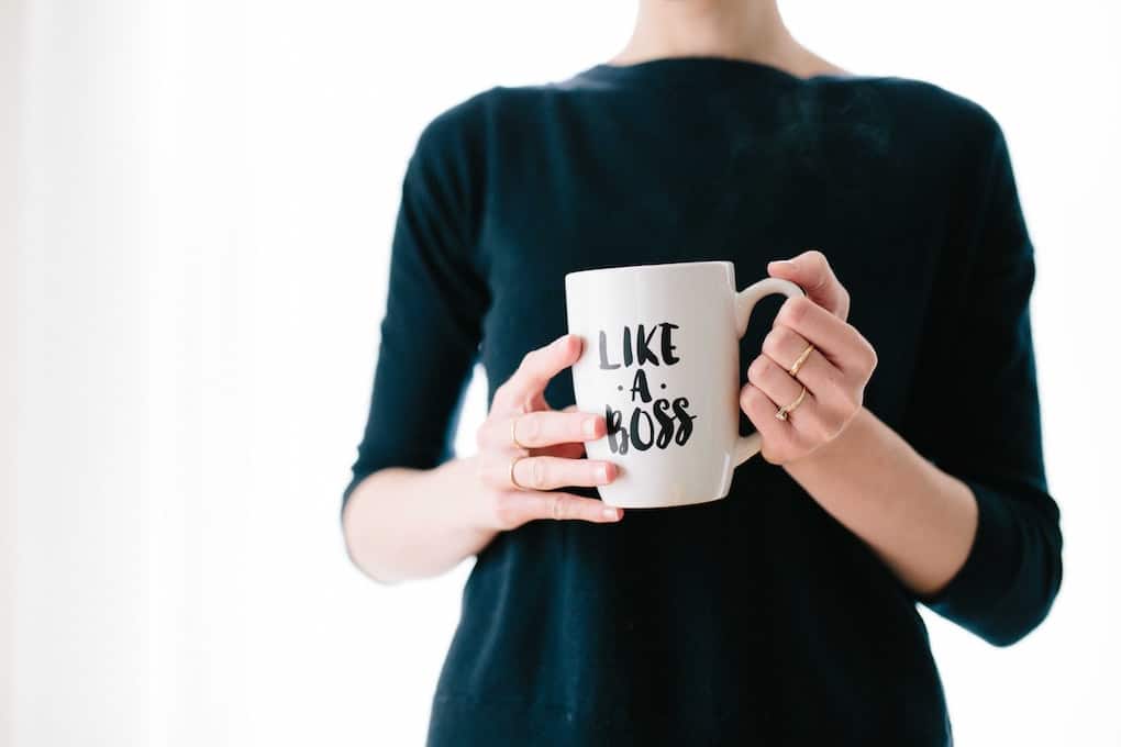 woman holding mug which reads "like a boss"