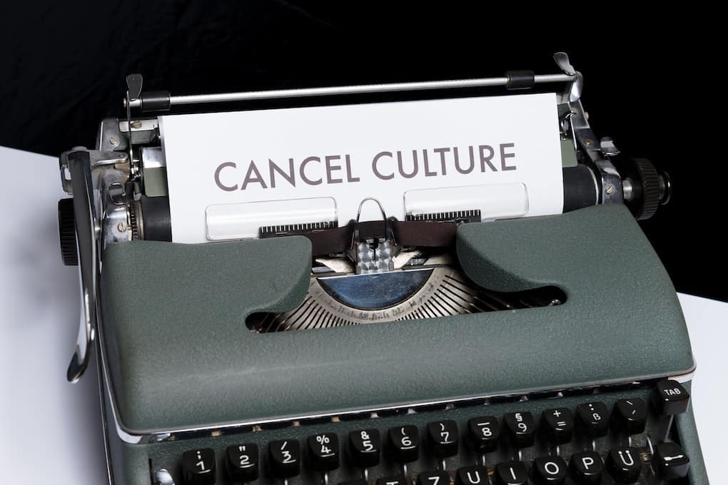 typewriter with paper with the words "cancel culture" written on it