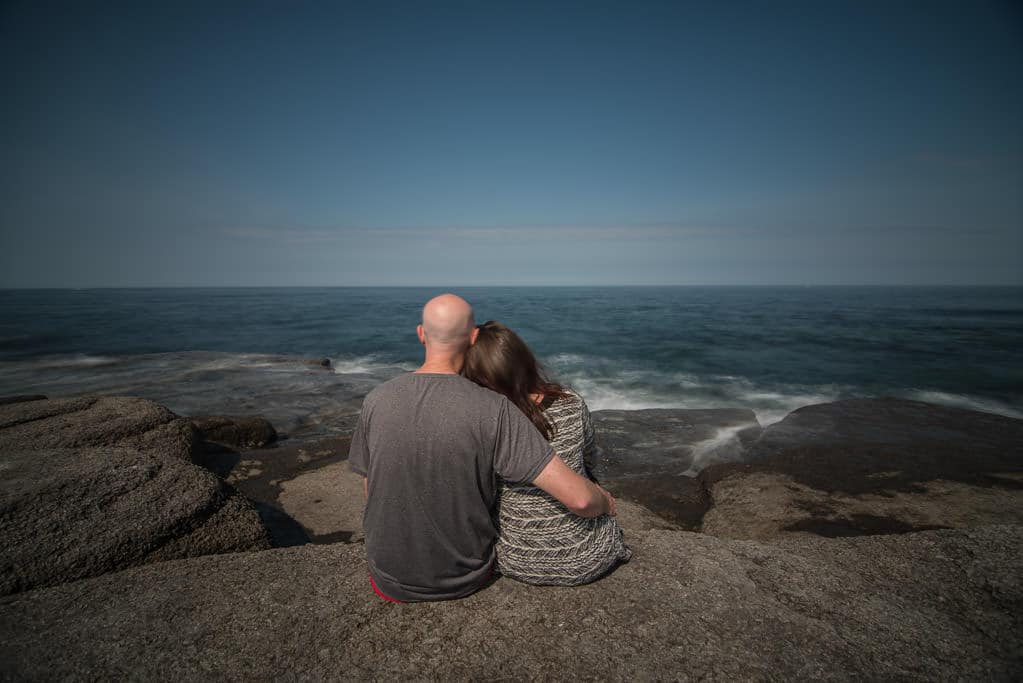 Brooke and Buddy enjoying the sound of the ocean near Point Riche Lighthouse