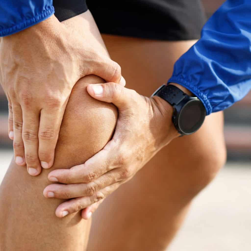 Knee with hands around it - personal injury claim