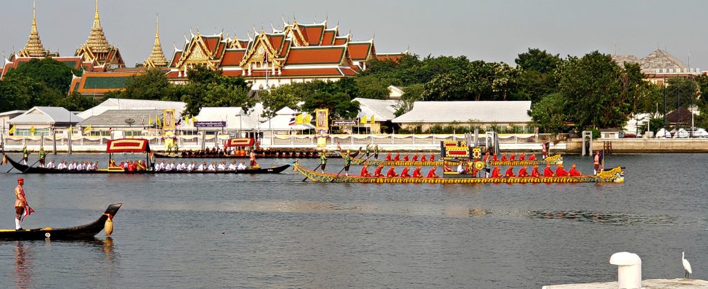5 long boats cruise the Chao Phraya River for the Thai Royal Barge Processional