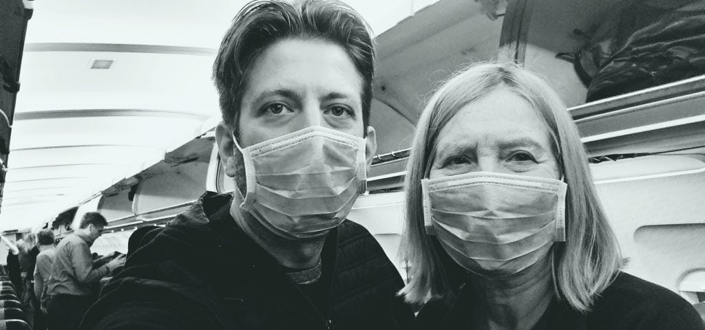 jason and Carla Rupp with face masks - another way COVID-19 affected travelers