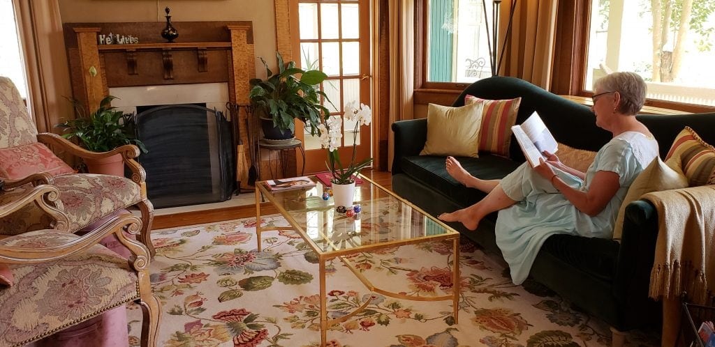 UNSTPPABLE Stacey reclines in elegant parlor of one of Asheville NC B&Bs