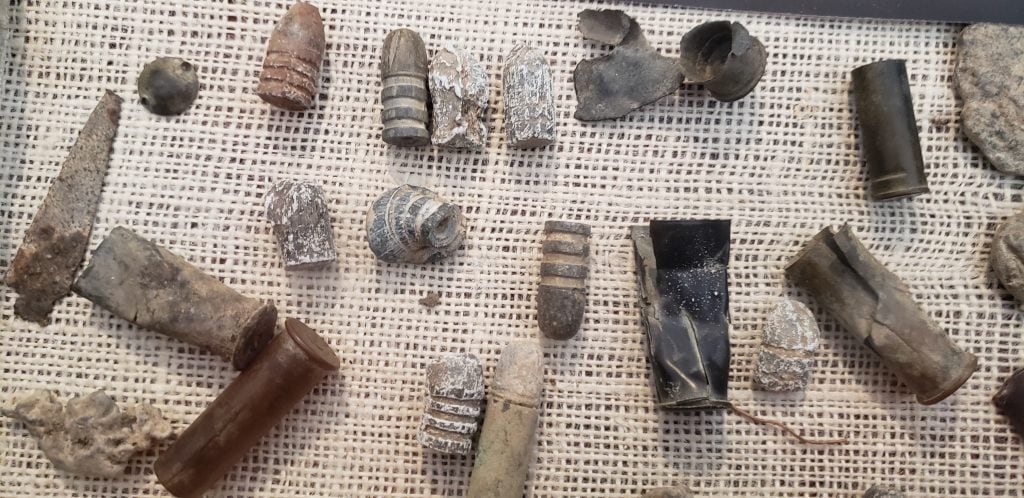 Bullets and casings unearthed at Powder River Battlefield in display case