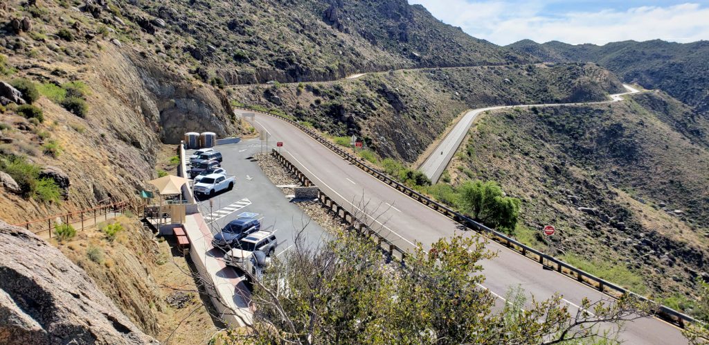 looking down at the small parking lot at Granite Mountain Hotshots Memorial State Park with twisty road in the background
