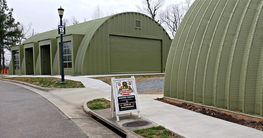 two Quonset huts used for visitor center, gift shop and storage.