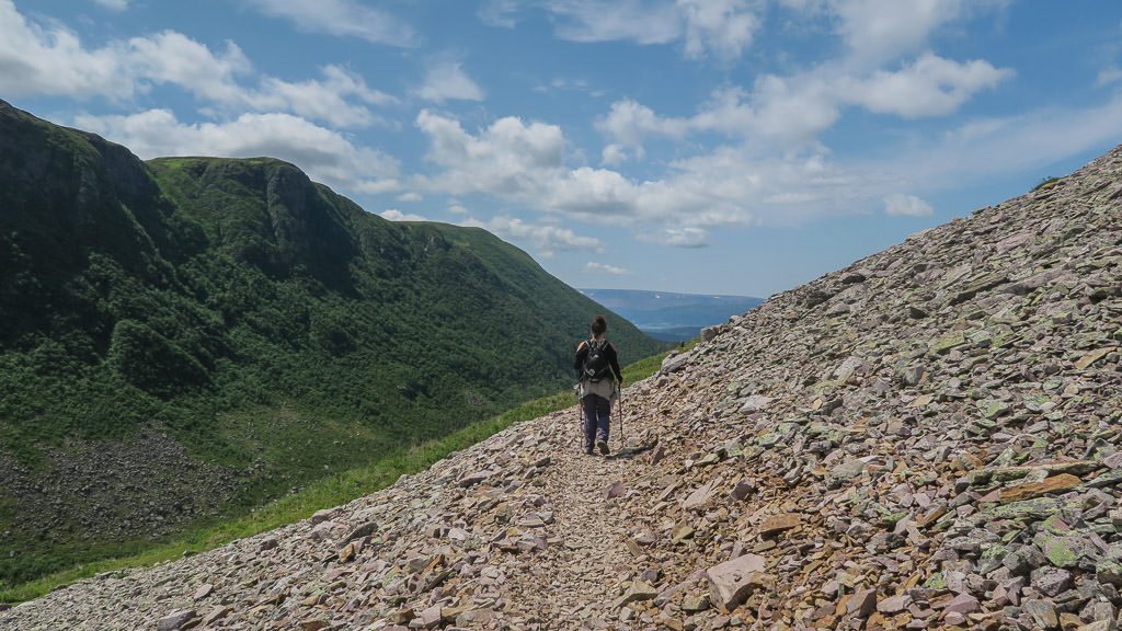 Brooke hiking down the rocky trail