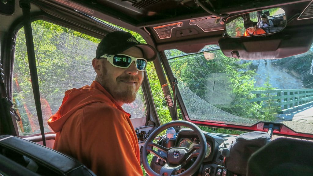 Buddy behind the driver's seat of the ATV on our Newfoundland ATV Tour