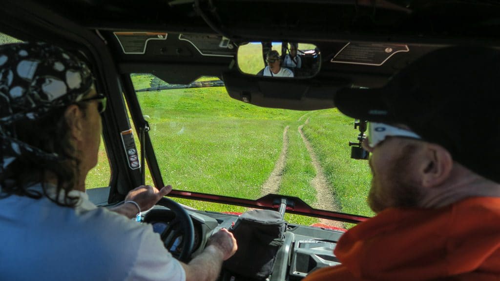 Paul driving the ATV with Buddy in the passenger seat during our Newfoundland ATV Tour