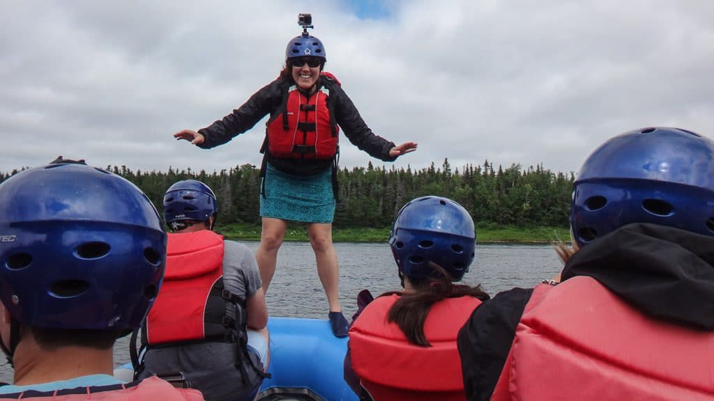 Brooke standing on the edge of the raft during the balance game