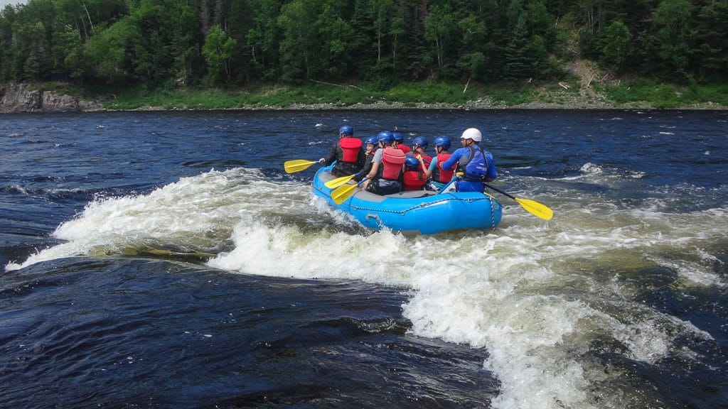 Surfing the waves of the Exploits River with ONadventure Wilderness Tours