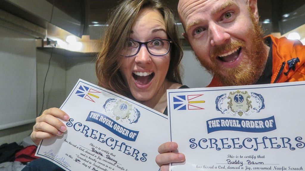 Brooke and Buddy holding their certificates showing they were officially screeched in, which is the top thing to do in Gros Morne National Park, or Newfoundland in general