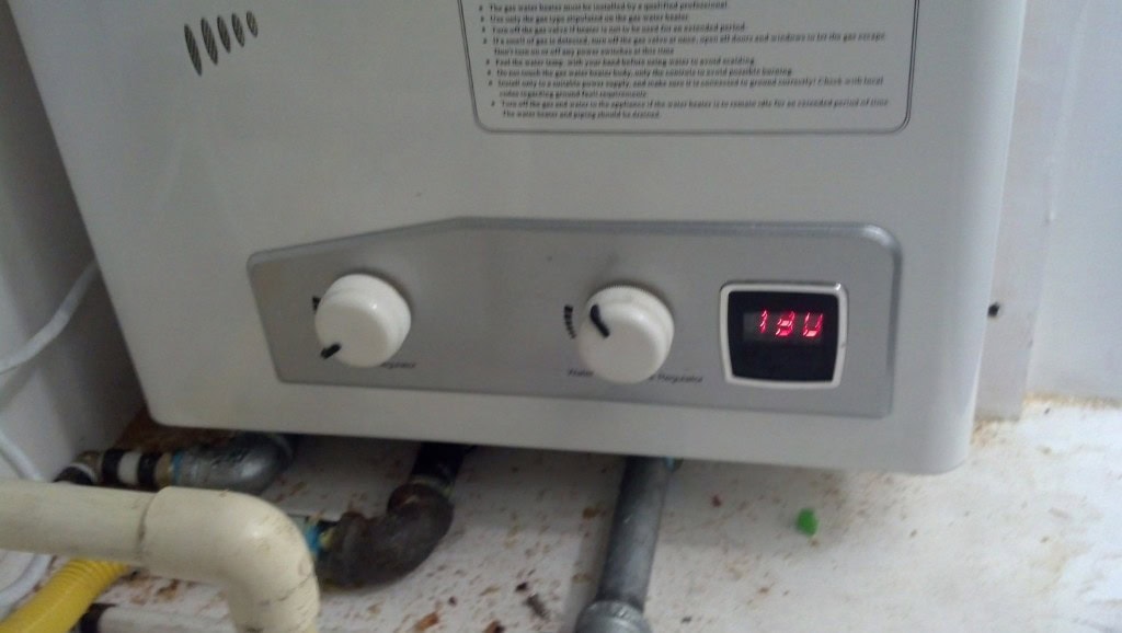 This is the settings of my water heater which seem to work very well I have to turn the shower on high to let the wather heater kick on, once it does I can turn it to whateer temperature I like. The knob on the left is the propane regulator, seems to work well lower, the one on the right is the water temperature, which I have on high.
