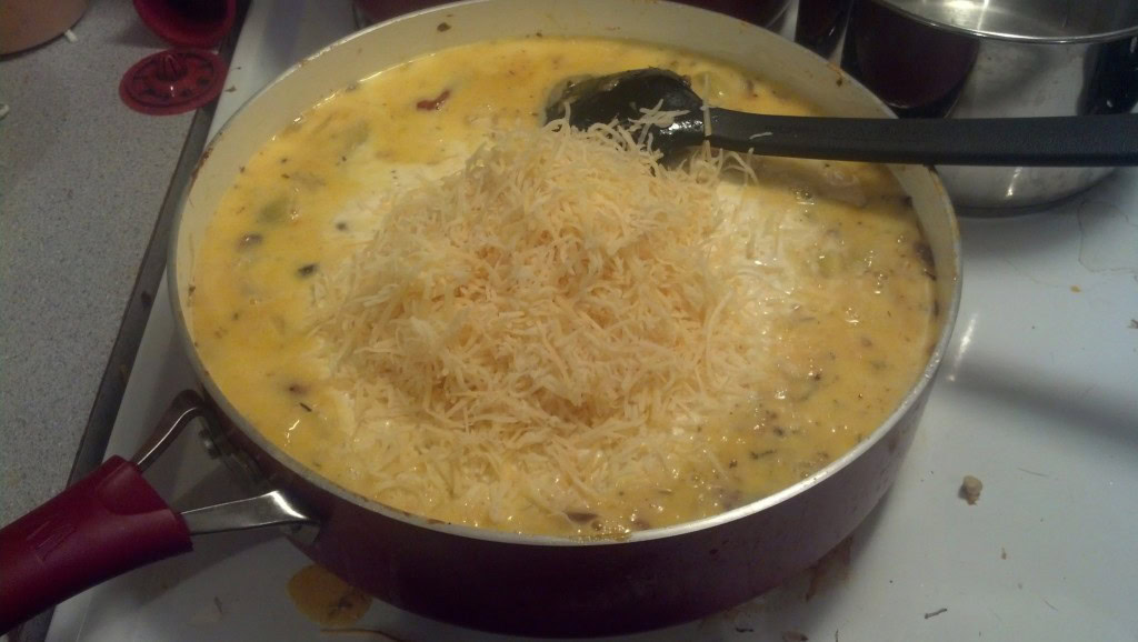 then I add 'some' (maybe a quarter of a gallon) half and half (you can use milk and a thickener too if you want it healthier, I want the calories in this particular batch), and about 2 cups of parmasean cheese