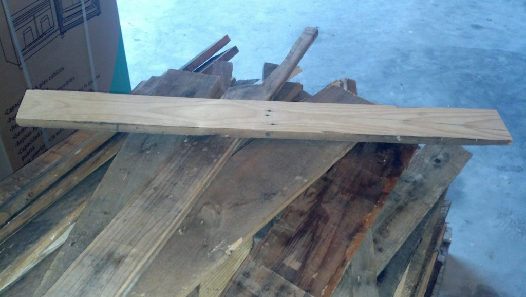 Here is the first piece of siding.  Prior to planing it looked just like the ones below it.  I think these will all clean up great and stain up super nice!  Excited to see how it goes!