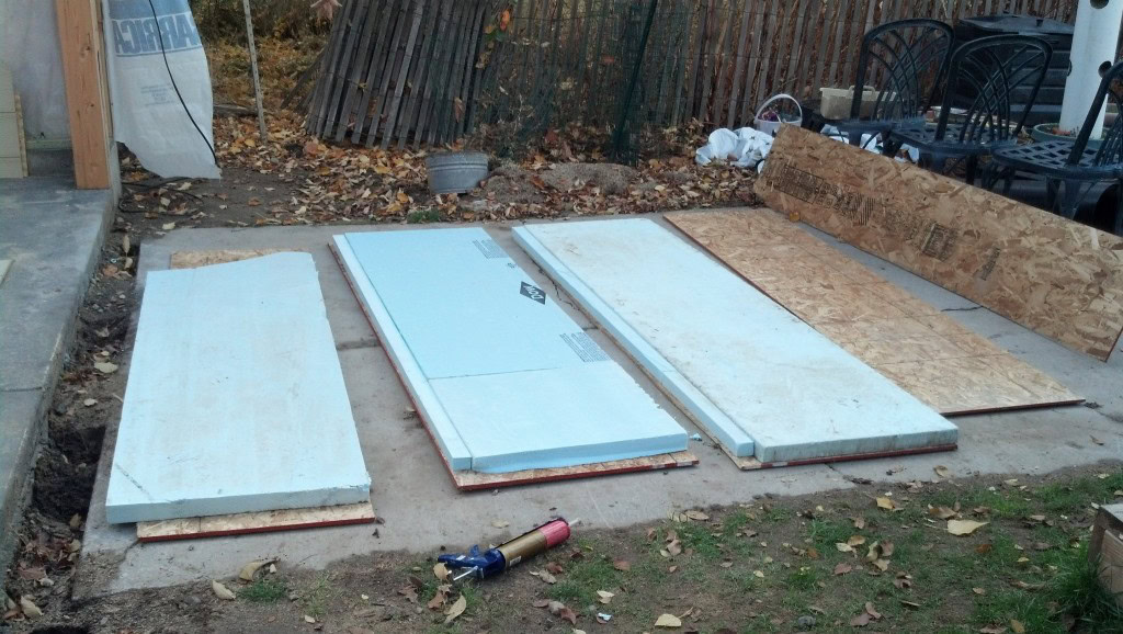 And onto the real work... Making the insulated panels for the skirting.  I just used construction adhesive to glue a piece of riged insulation to some left over OSB I had.