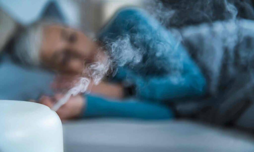 woman sleeping with humidifier running