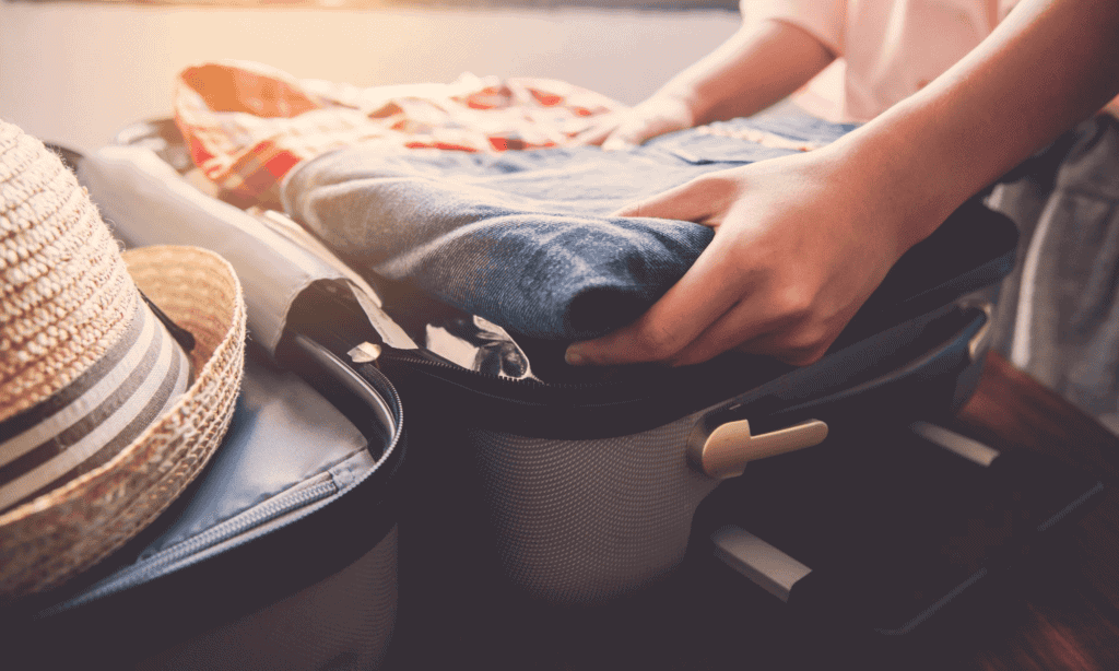 woman packing a carry-on bag