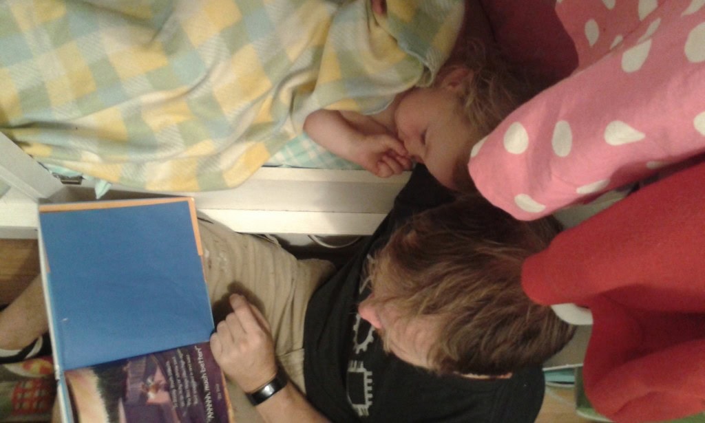 Da-da reading her her bedtime stories. Her favorite is Bed Hogs I know it by heart :)
