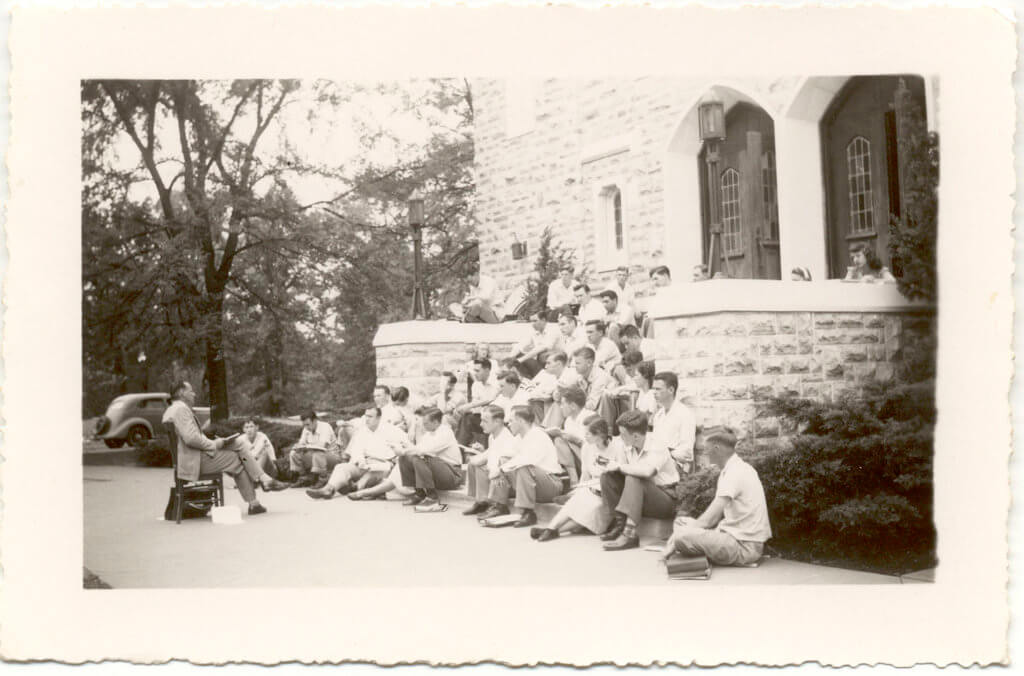 Historical photo of class in front of the steps of the chapel.