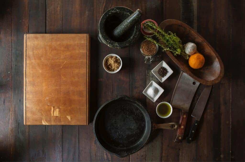 cookbook with spices on table