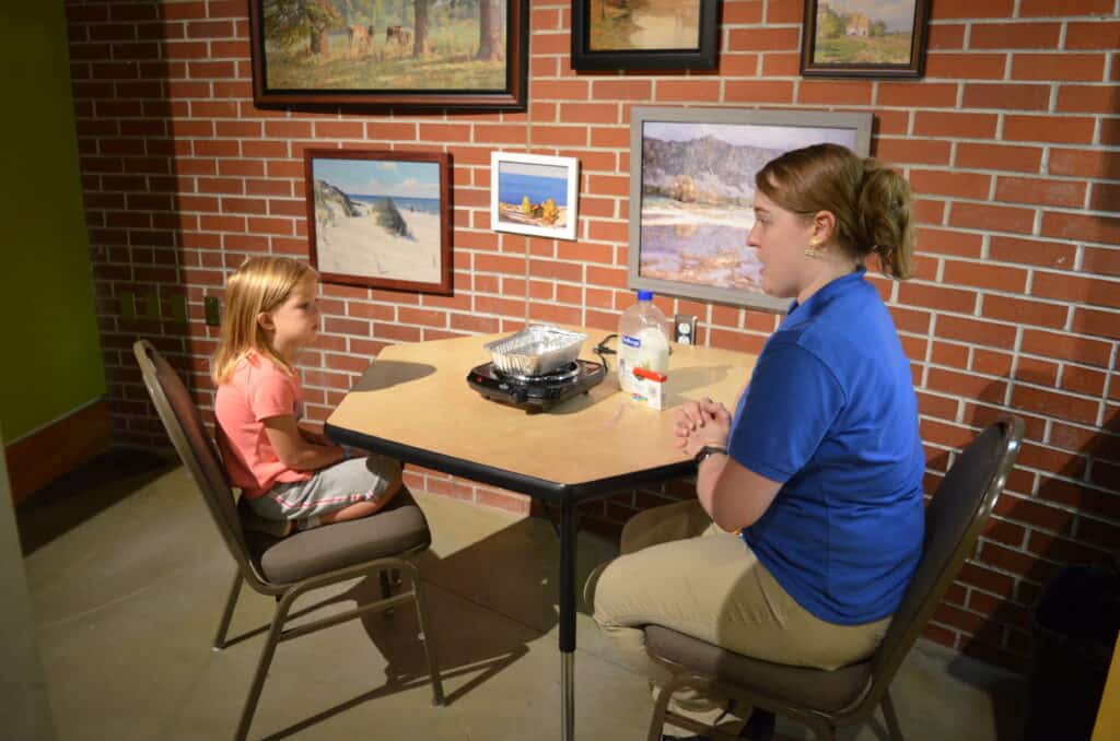 little girl with science experiment group