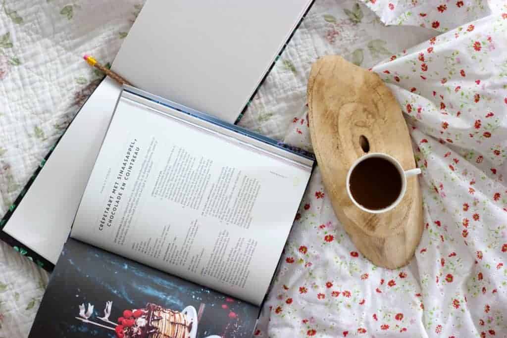 book on quilt with coffee