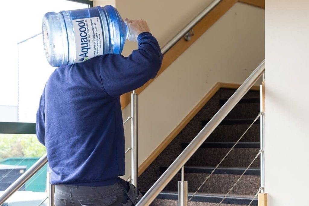 Aquacool employee carrying a water bottle