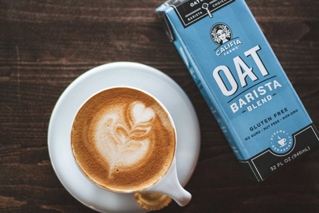 oat milk coffee and milk carton
