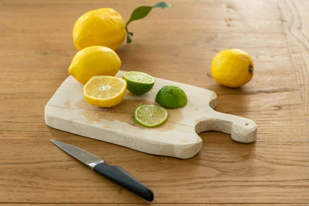 Substitute lemon or lime juice for sale. - sliced lemon beside knife on brown wooden chopping board