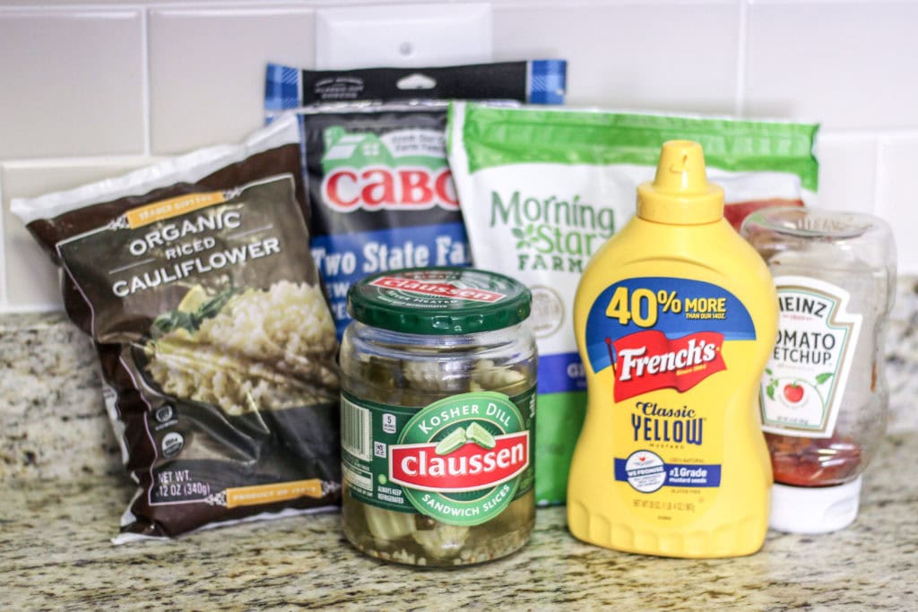 All the ingredients needed for a vegetarian burger in a bowl.