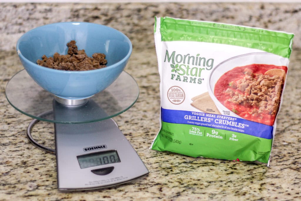 Measuring out the meatless crumbles.