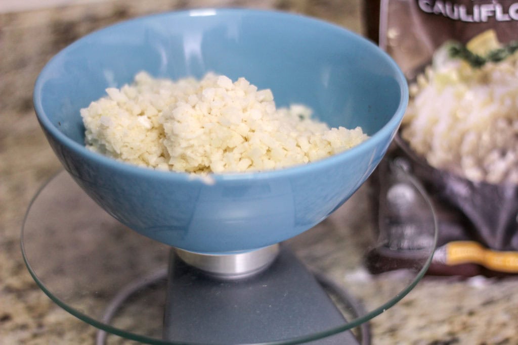 Measuring out the cauliflower rice.