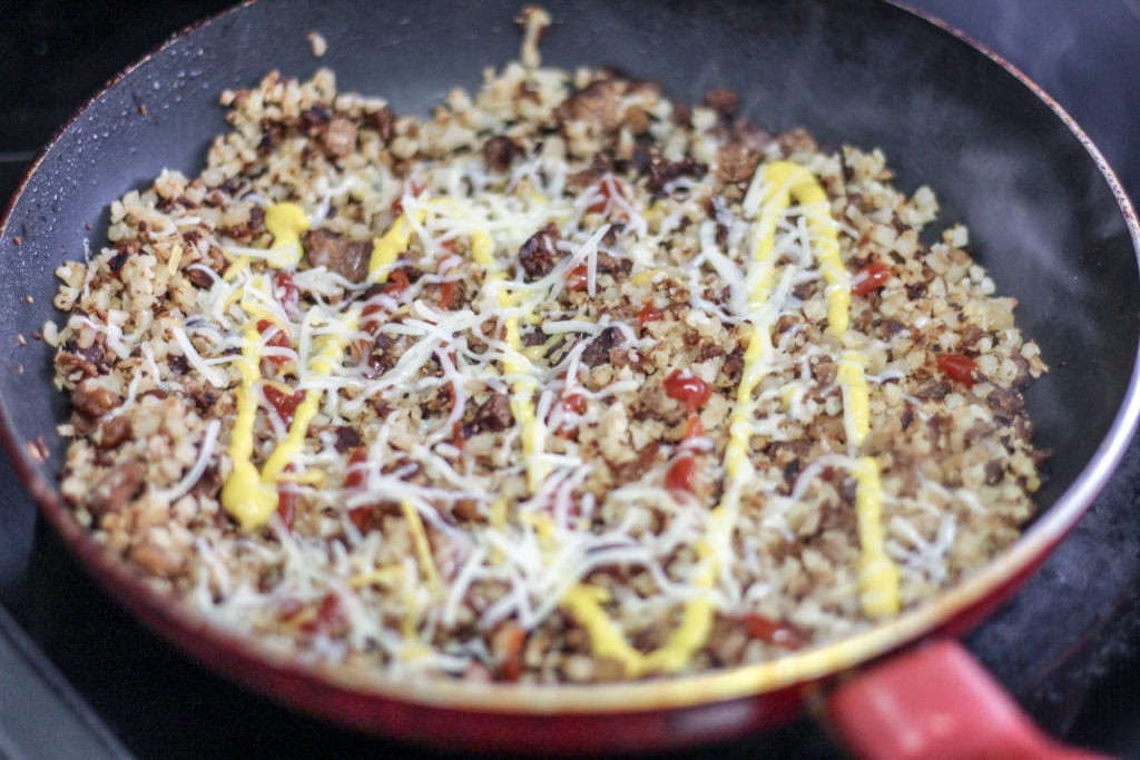 Mixing the ingredients with the meatless crumbles.