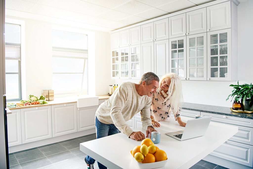 Older Couple looking at Privy to Invest in Real Estate as a Self-Directed IRA