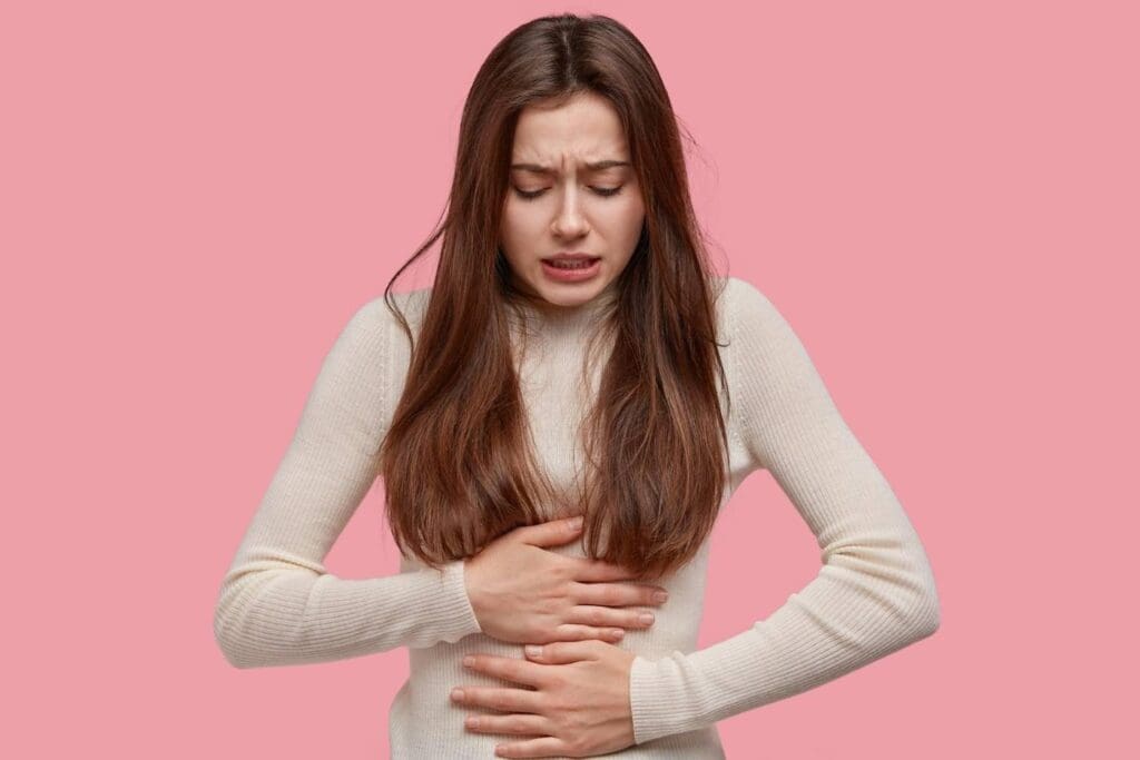 girl with everyday pain such as stomach discomfort