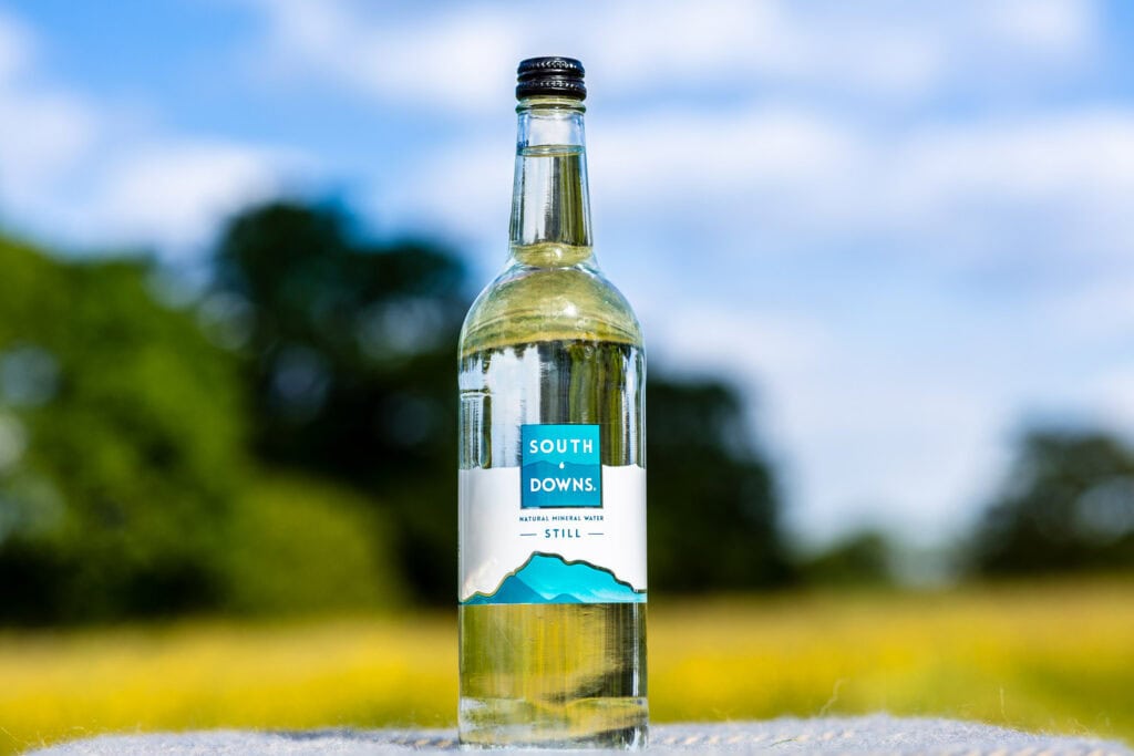 south downs water glass bottle in a yellow field - South Downs Water
