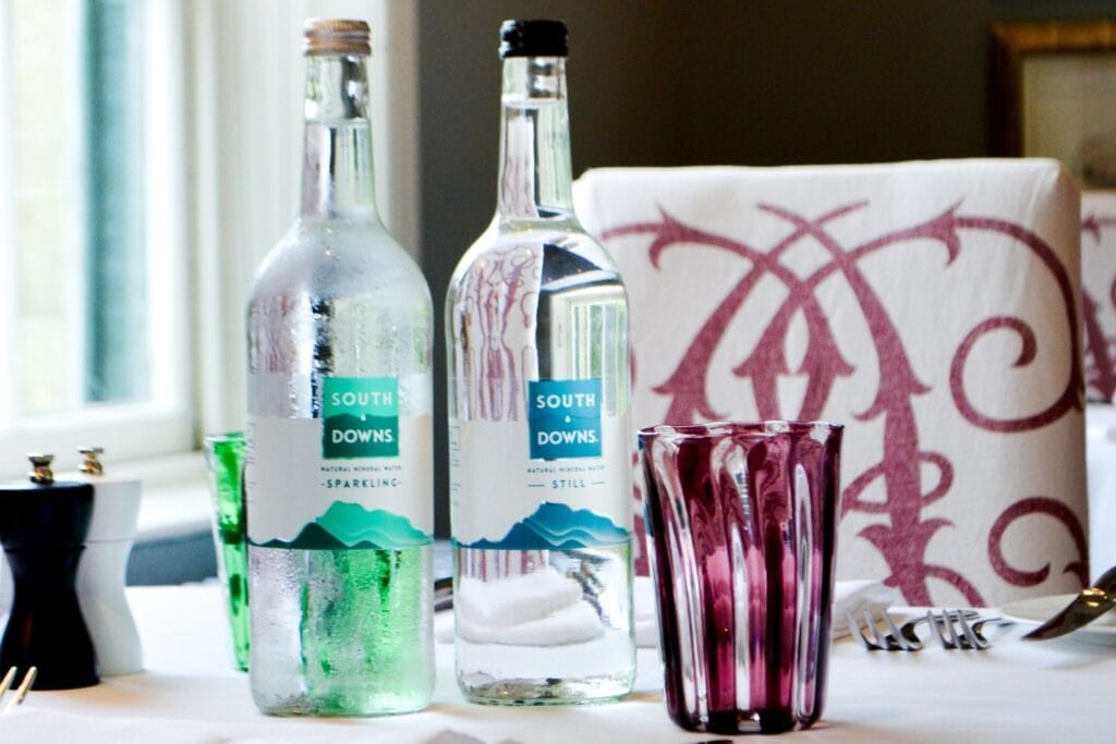 Glass Bottles on Table | South Downs Water