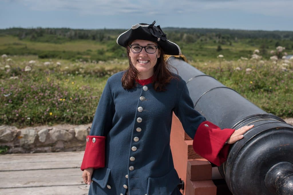 Brooke in her cannon firing outfit posing next to the cannon she had just fired