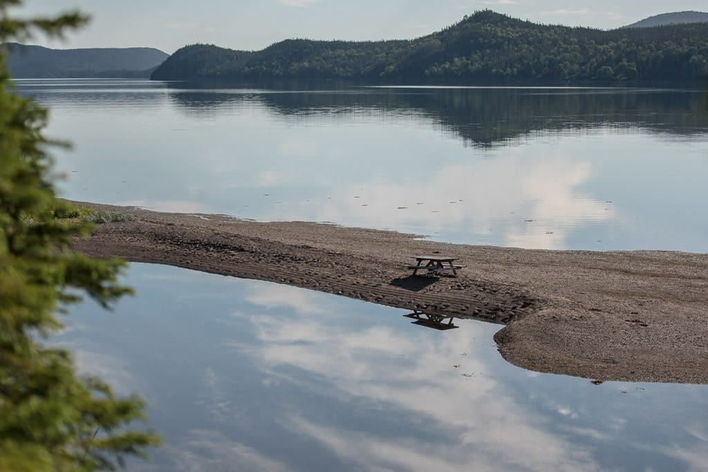 Picnic table on a rocky peninsula  on the Coastal Trail near Newman Sound Campground