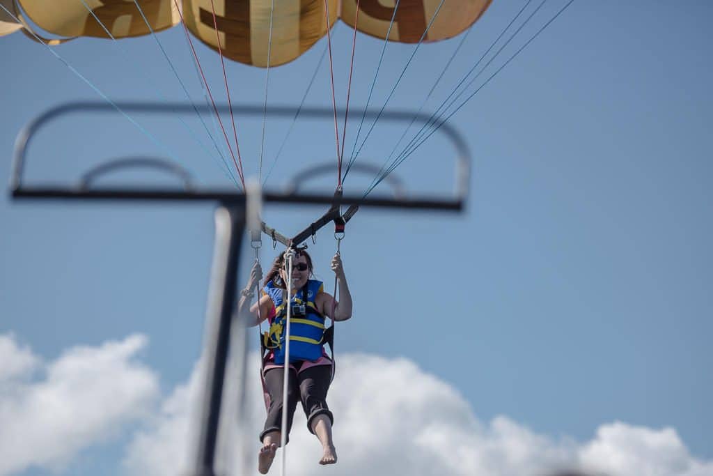 Brooke has a huge smile on her face during take-off on her parasailing tour with Inn at the Pier