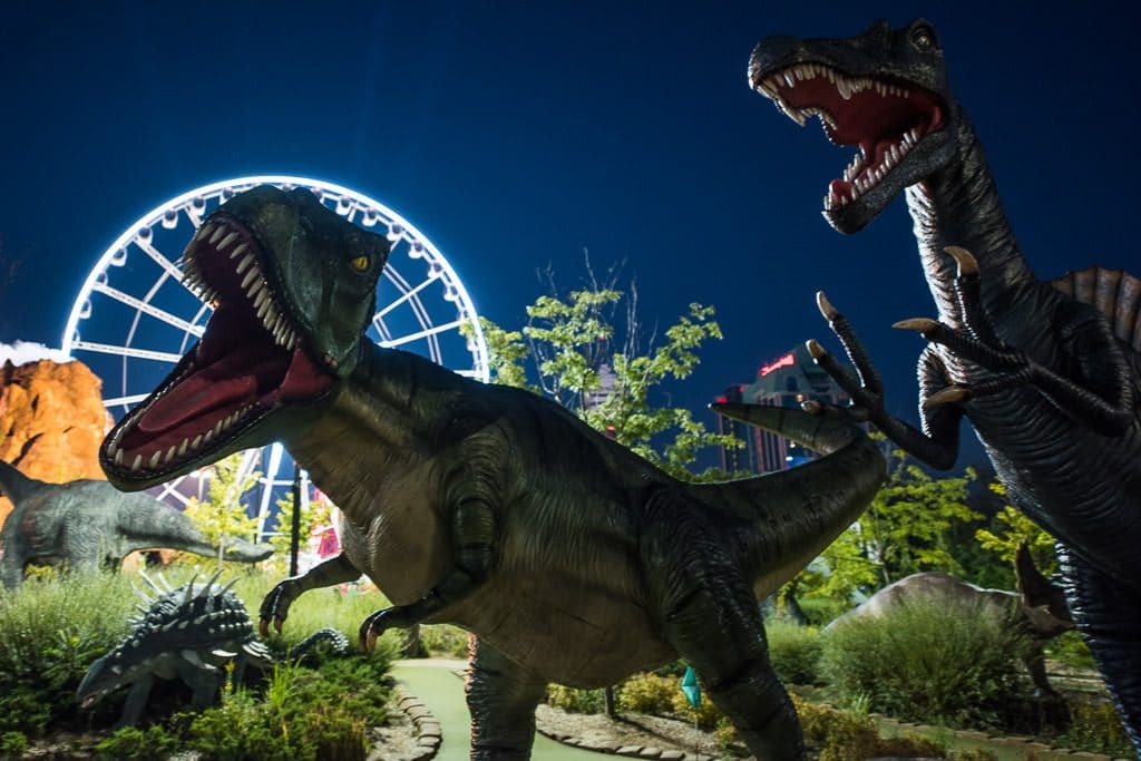 Dinosaurs at the putt-putt corse at Niagara Falls with the skywheel in the background