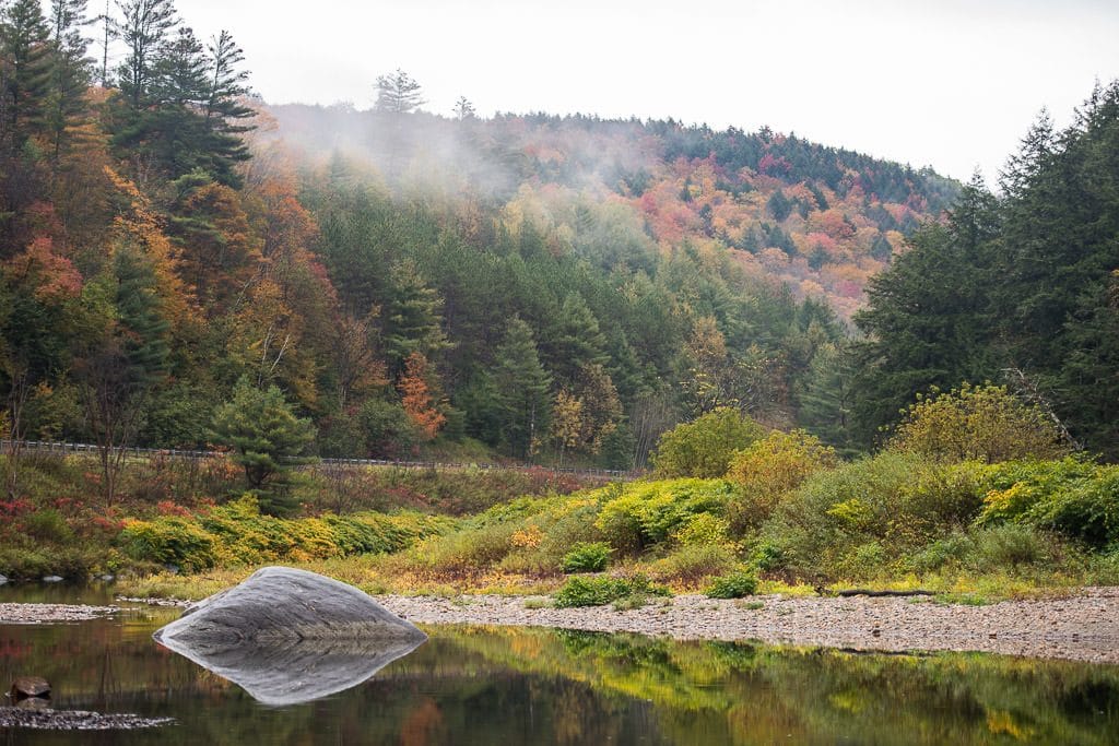 River with fog coming in over the Vermont fall foliage during our Vermont Road Trip