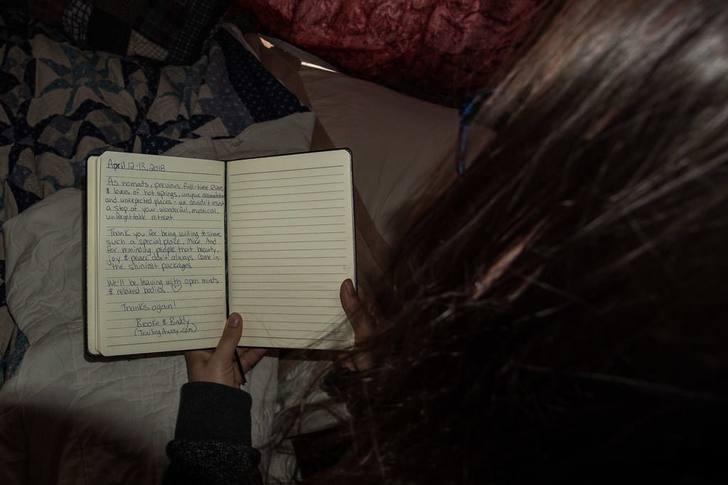 Brooke rereading our entry into the guestbook in The Ripple at Mystic Hot Springs