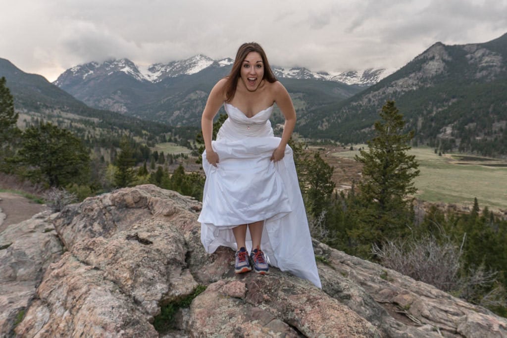 bride with hiking shoes for rocky mountain vow renewal photo