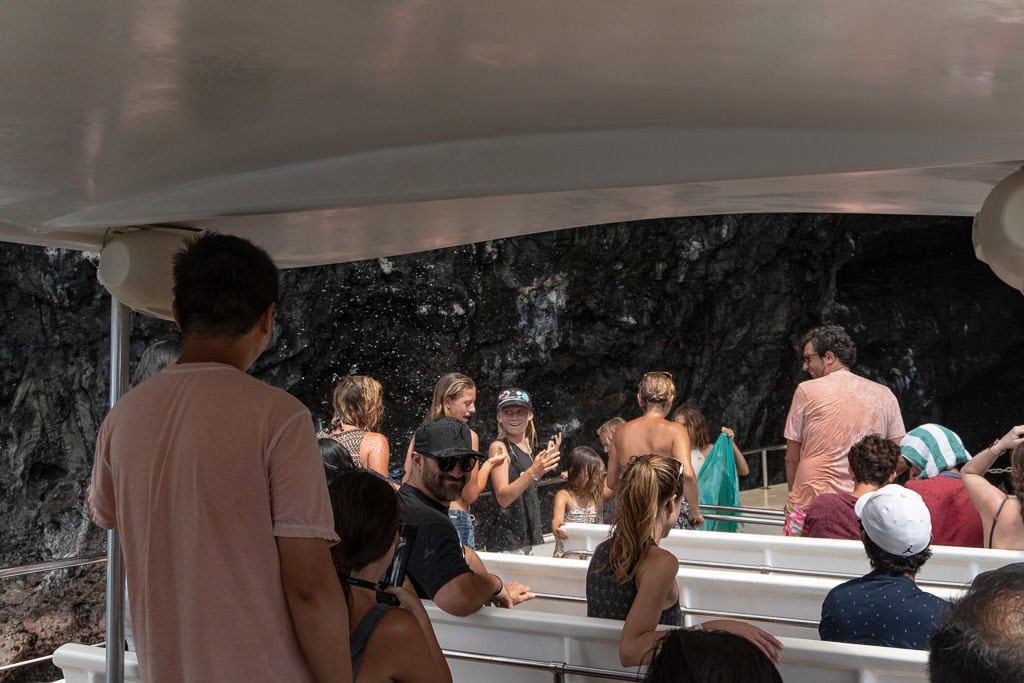 going under a waterfall on napali coast boat tour with makana charters