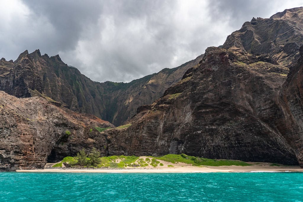 blue waters and napali coast cliffs in kauai